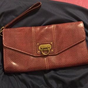 Maroon snake print clutch with wrist strap